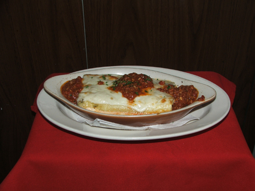 Cannelloni Grattinati with meat, mozzarella cheese and tomato sauce.