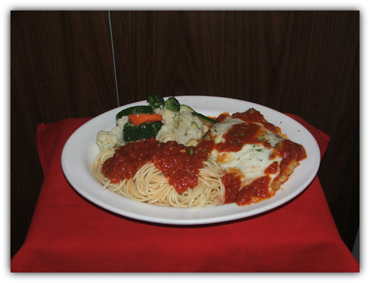 Vitello Parmigiana. Breaded veal, marinara sauce and cheese.