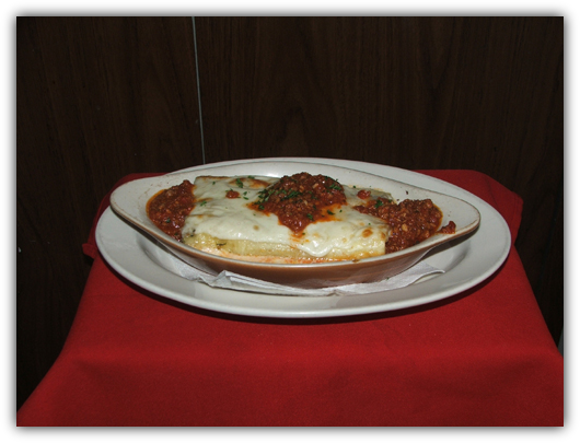 Cannelloni Grattinati with meat, mozzarella cheese and tomato sauce.