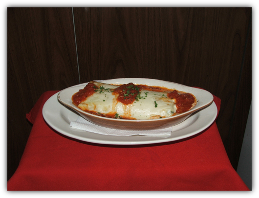 Manicotti Alla Marinara with ricotta cheese and tomato sauce.