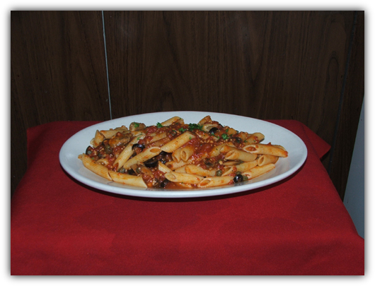 Penne Puttanesca with mushrooms, capers, black olives and tomato sauce.