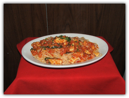 Capellini Con Pollo Al Pomodoro. Angel hair pasta with chicken and pomodoro sauce.