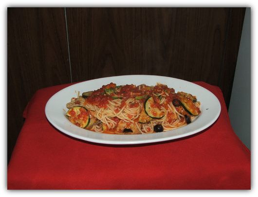 Spaghettini Alla Sicilliana with eggplant, olives,zucchini and tomato sauce.