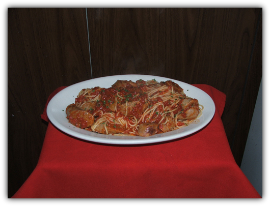 Spaghettini with Italian Sausage and tomato sauce.