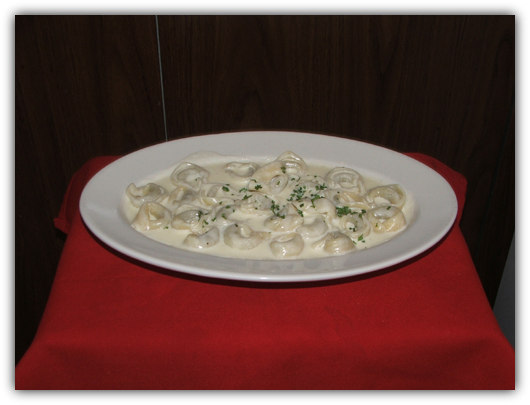 Tortollini Alla Pana. Stuffed with veal or cheese in a light cream sauce.