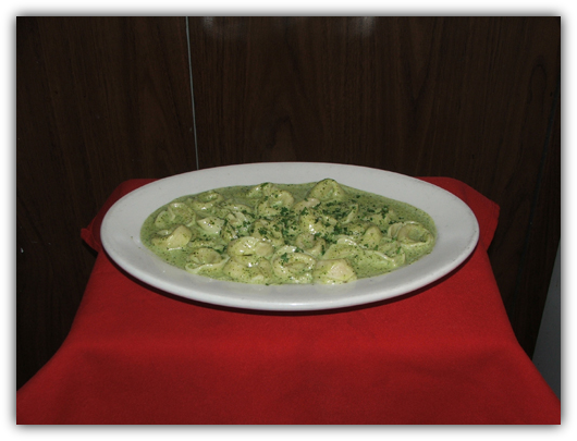 Tortollini Al Pesto. Stuffed with veal or cheese with a green pesto sauce.
