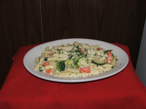 Pasta Napoletana. Choice of pasta with vegetables and cream sauce.