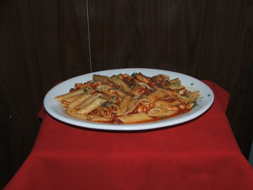 Penne Arriabiata Con Pollo with chicken and spicy sauce.