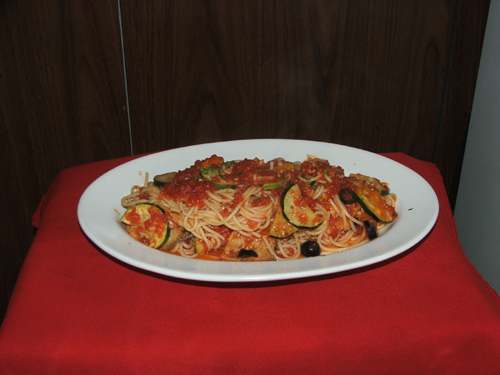 Spaghettini Alla Sicilliana with eggplant, olives,zucchini and tomato sauce.